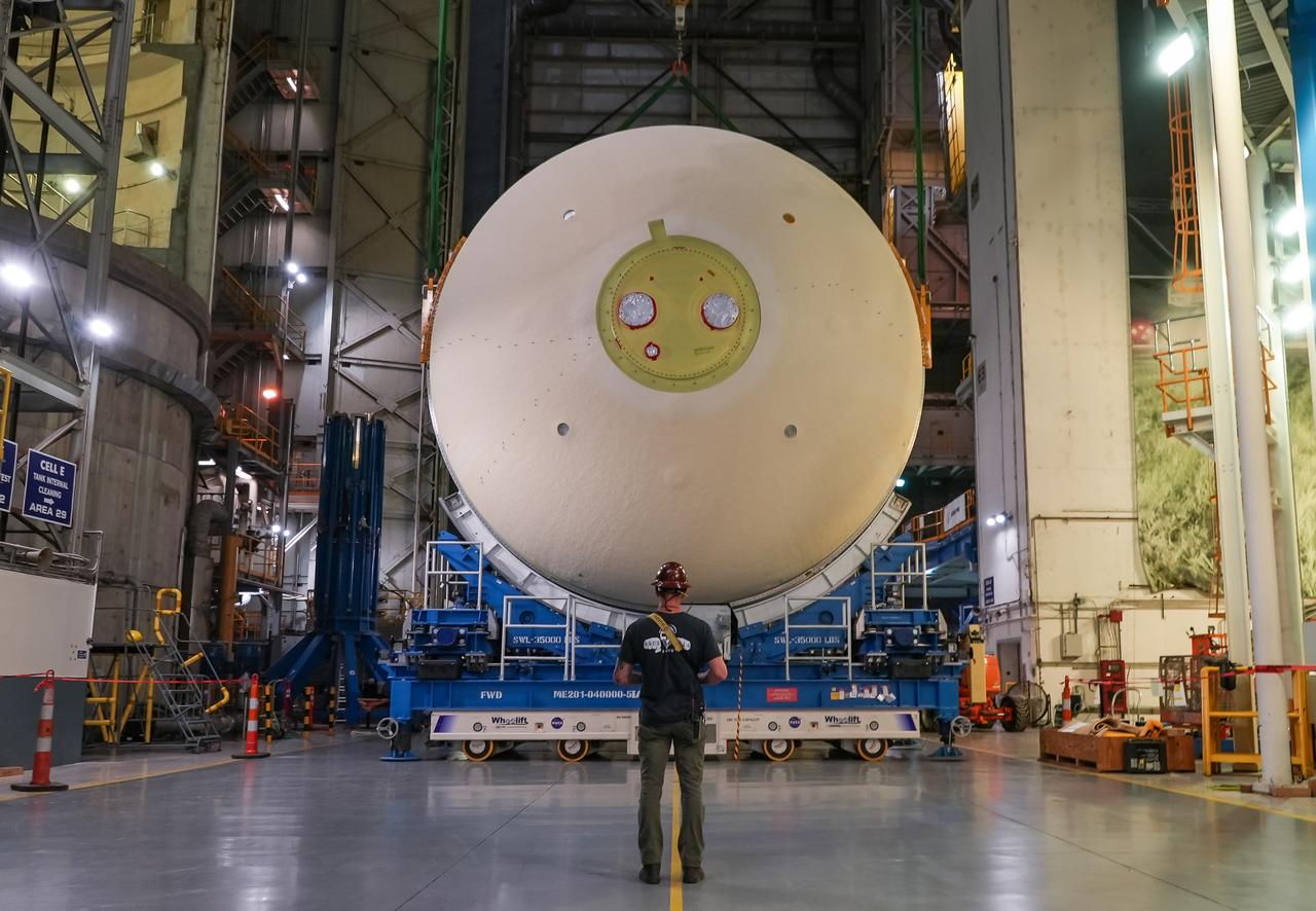 Move crews at NASA’s Michoud Assembly Facility in New Orleans perform “breakover” operations on a liquid oxygen tank in the facility’s vertical assembly building on Aug. 22, 2025. During the breakover, teams lifted the tank from its vertical configuration inside of a production cell and set it horizontally atop self-propelled mobile transporters for transfer to the final assembly production area. There, it will undergo integration of the forward dome by SLS (Space Launch System) prime contractor, Boeing. Eventually, the liquid oxygen tank will be moved back to the high bay where it will be mated with the intertank and forward skirt to complete the forward join of the Artemis III core stage. The propellant tank is one of five major elements that make up the 212-foot-tall rocket stage. The core stage, along with its four RS-25 engines, produce more than two million pounds of thrust to help launch NASA’s Orion spacecraft, astronauts, and supplies beyond Earth’s orbit and to the lunar surface for Artemis.